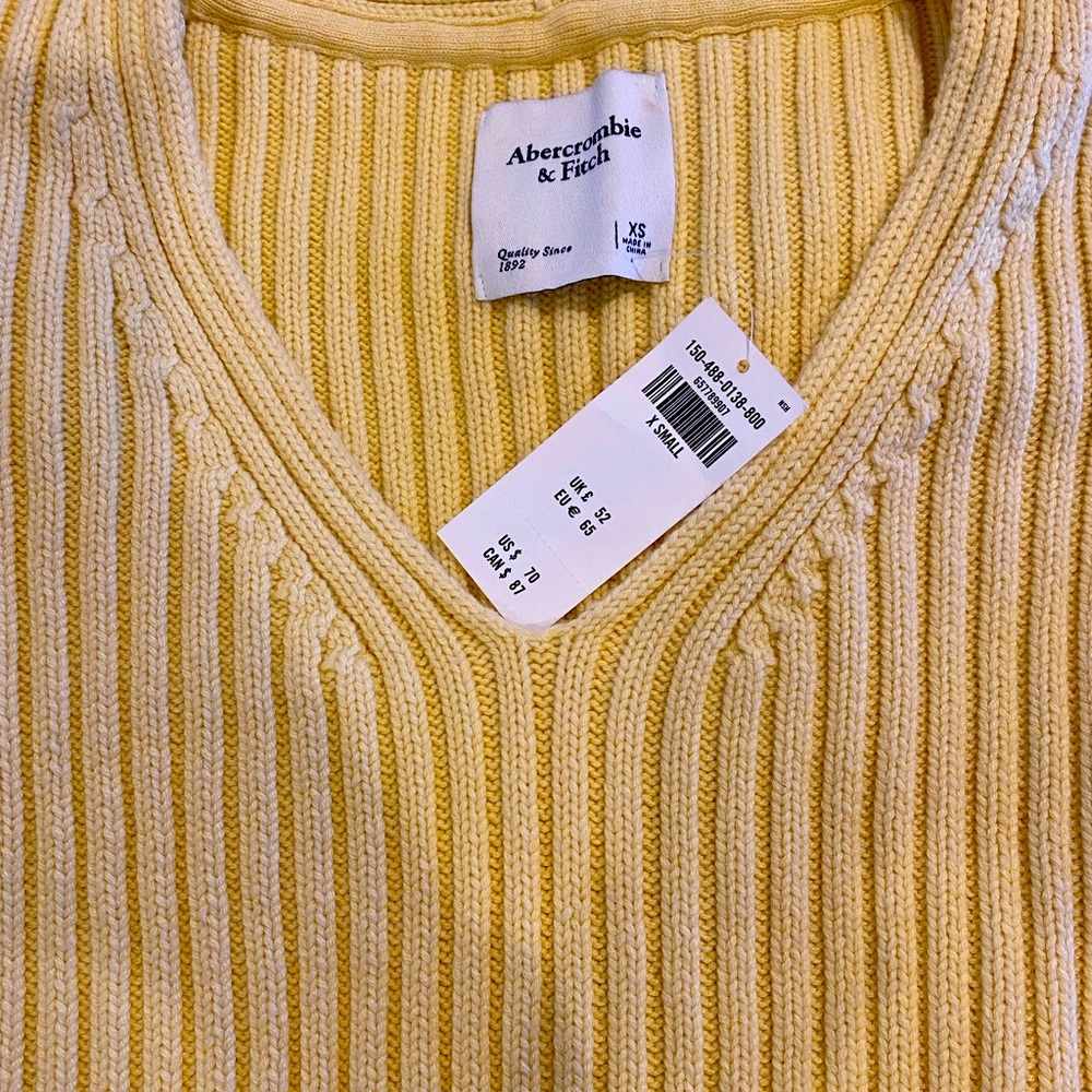 New with tag.  Abercrombie & Fitch yellow V-neck sweater.  Size XS